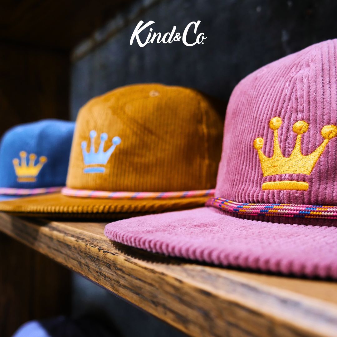 Kind & Co corduroy crown hats on a wooden shelf
